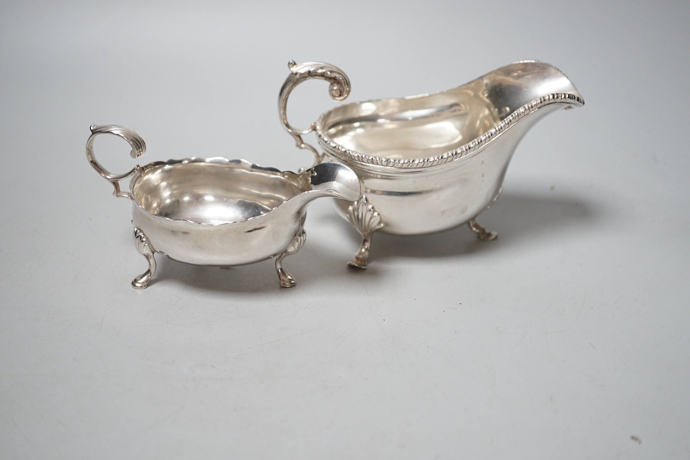 A George III silver sauceboat, London, 1759 and a later sauceboat, 10.8oz.
